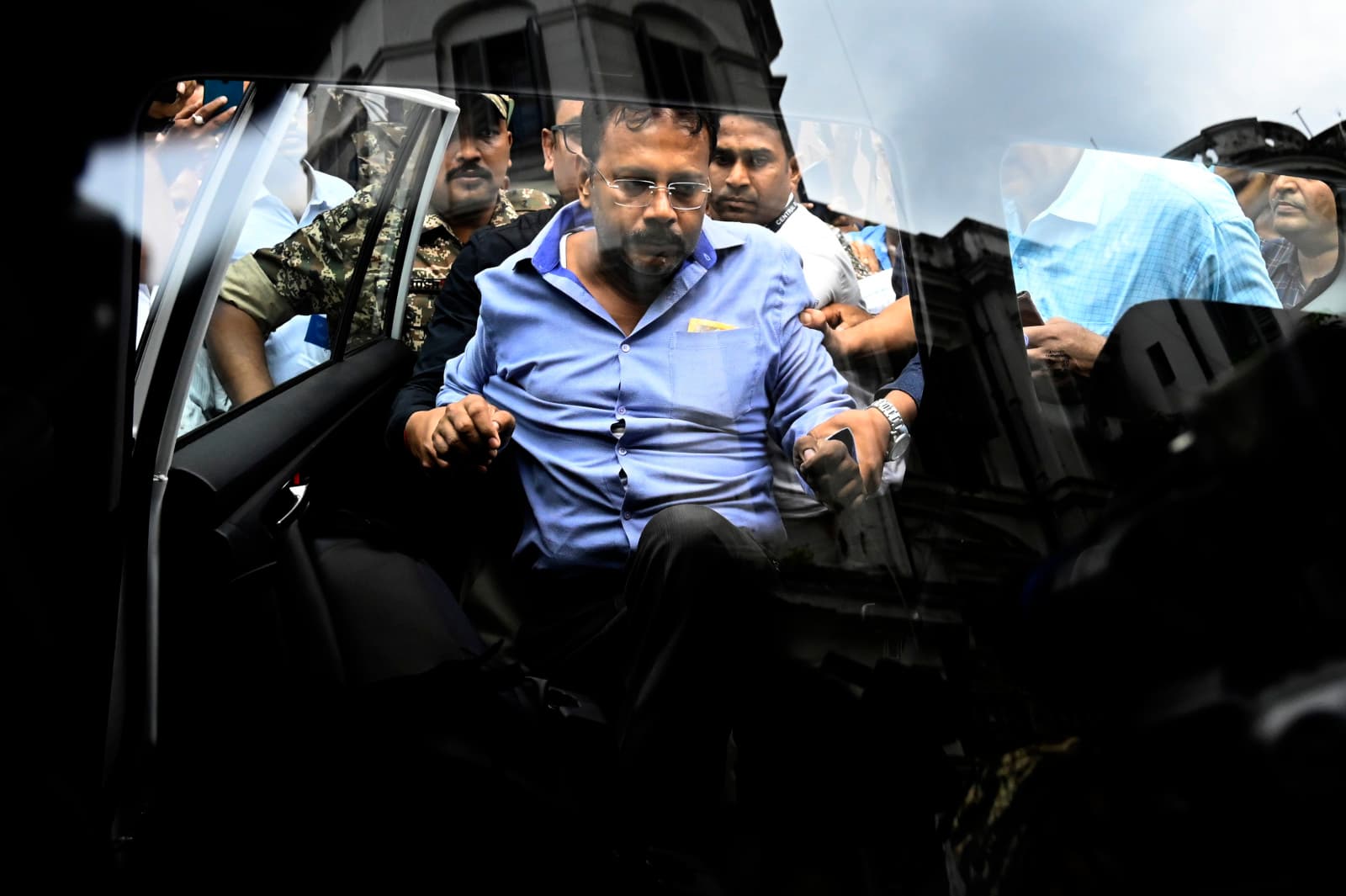 Former principal of R.G. Kar Medical College and Hospital Sandip Ghosh escorted by security officials to Alipur CBI Court on September 3, 2024 in Kolkata, India (Samir Jana/Hindustan Times via Getty Images)