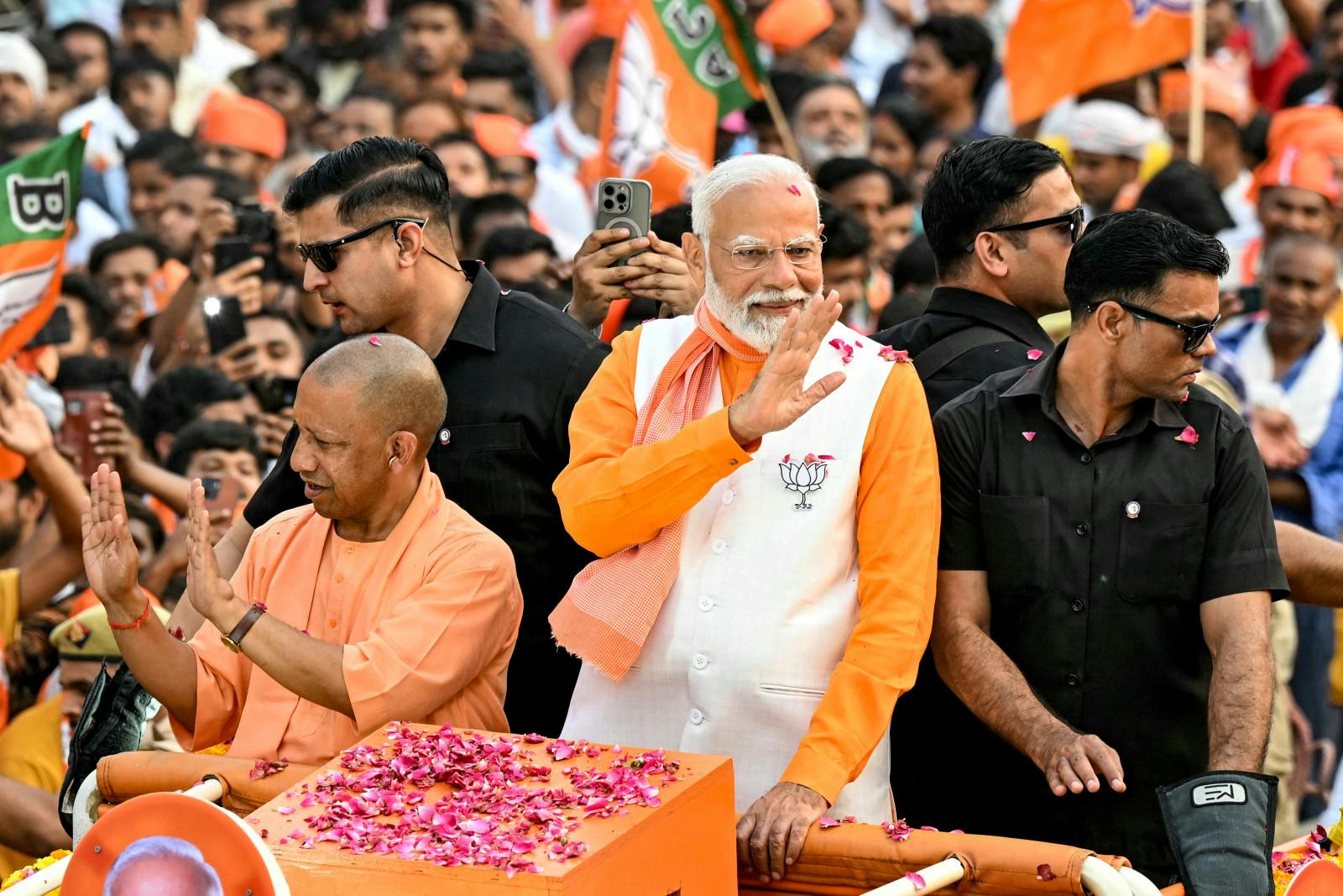Narendra Modi with Yogi Adityanath in Varanasi on May 13, 2024 (SAJJAD HUSSAIN/AFP via Getty Images)