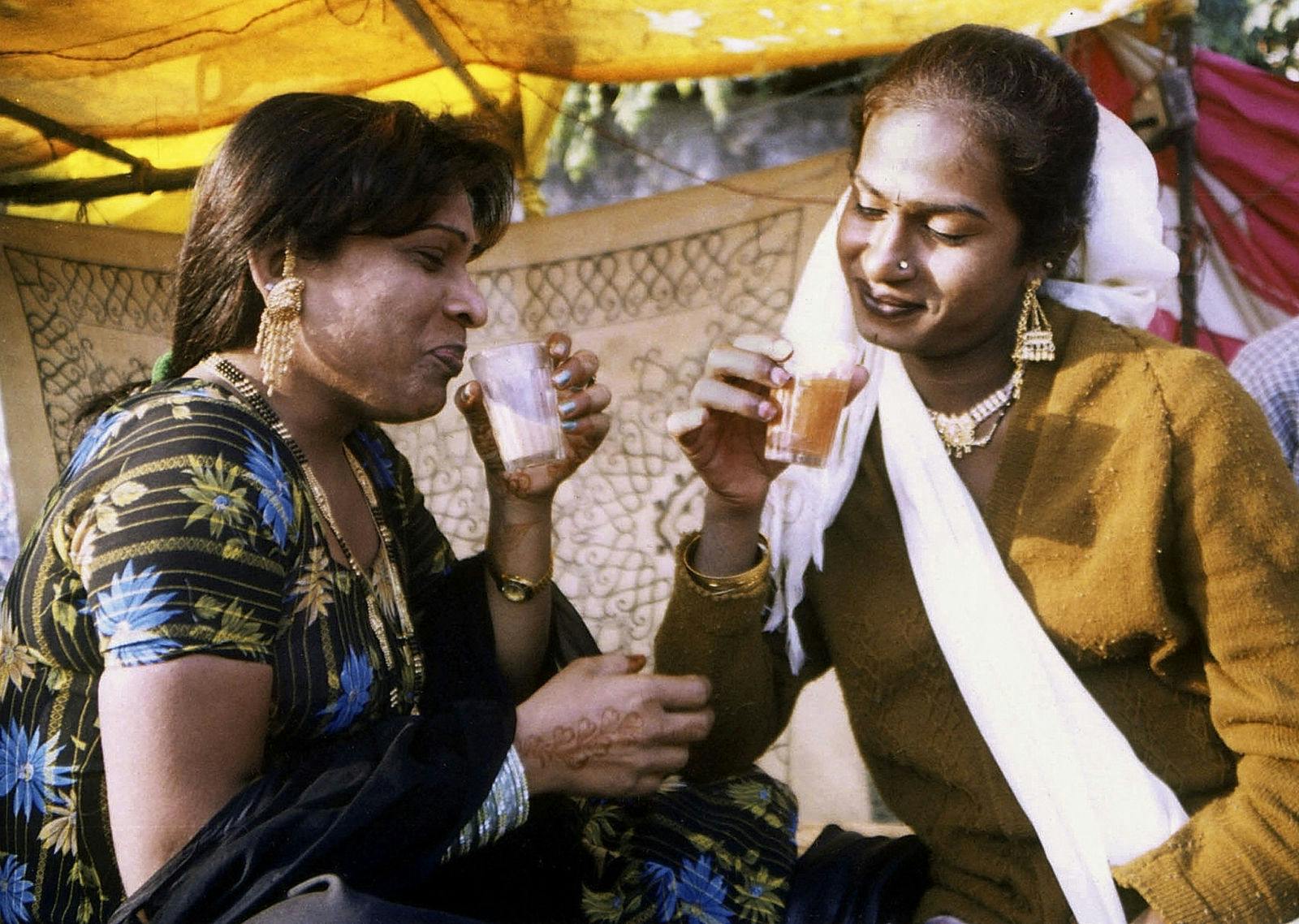 Rekha (L), from New Delhi, and Shabnam from Bombay sipping cups of tea in Varanasi during a convention (PAWAN KUMAR/AFP via Getty Images)