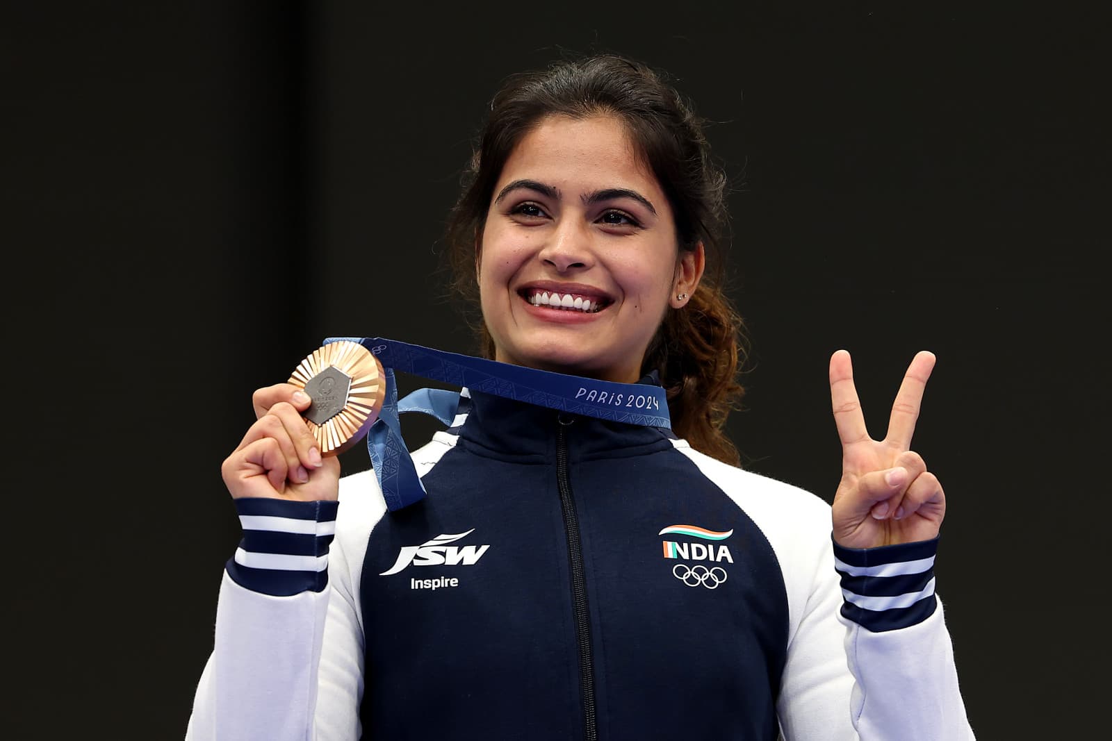 Bronze medalist Manu Bhaker of Team India poses on the podium during the Women's 10m Air Pistol Final medal ceremony on day two of the Olympic Games Paris 2024 (Charles McQuillan/Getty Images)