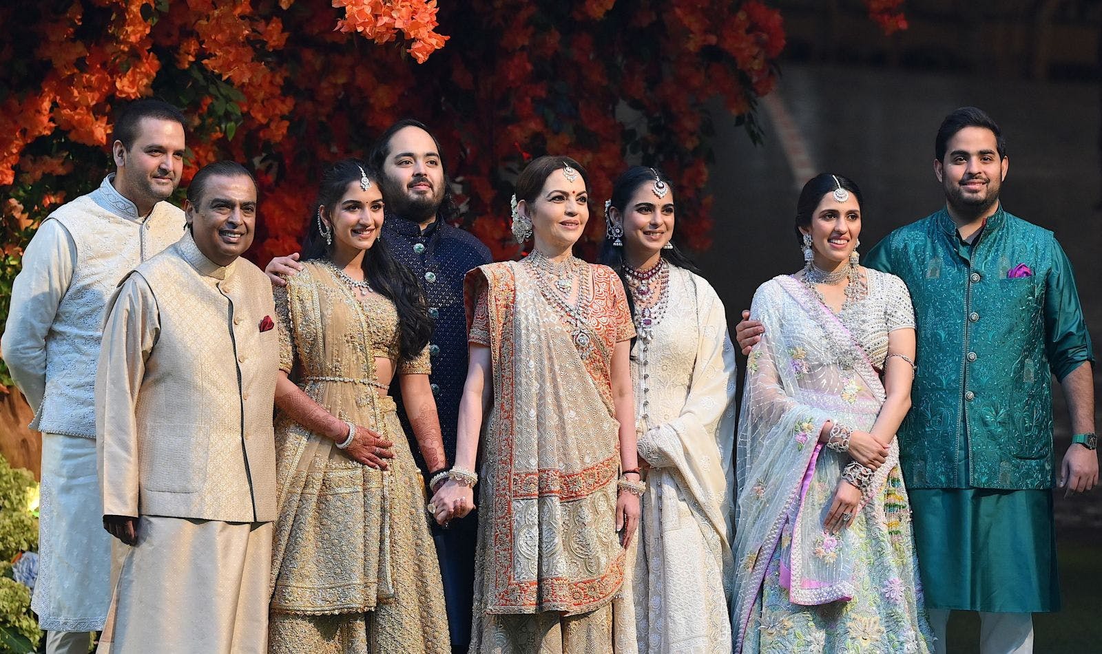 Anand Parimal, Mukesh Ambani, Nita Ambani, Radhika Merchant, Anant Ambani, Isha Ambani, Shloka Mehta, and Akash Ambani (from left to right) during Anant’s engagement in Mumbai on January 19, 2023 (Sujit JAISWAL / AFP / Getty Images)