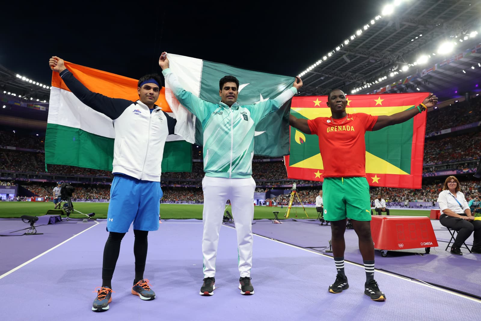 Silver medalist Neeraj Chopra of India, gold medalist Arshad Nadeem of Pakistan, and Anderson Peters of Grenada celebrate after competing in the the Men’s Javelin Throw Final on day 13 of the Olympic Games Paris 2024 at Stade de France on August 8, 2024 (Christian Petersen/Getty Images)